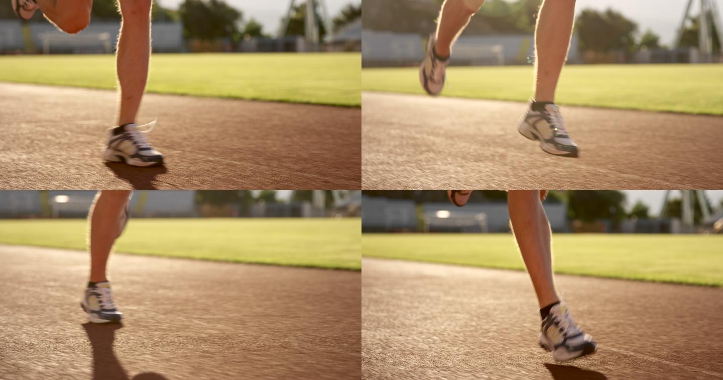 日落时分，一名白人男子在体育场内奔跑时的懒散双腿