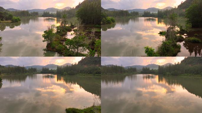 泰国宋克拉省贾纳区Liwong村的湖、山、松树的空中无人机日出风景
