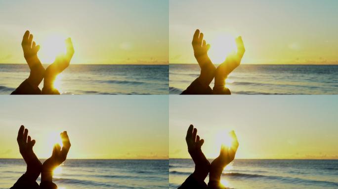 特写镜头：日落背景下，女人双手祈祷上帝保佑