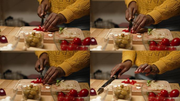 一位年轻女子切樱桃番茄的特写镜头