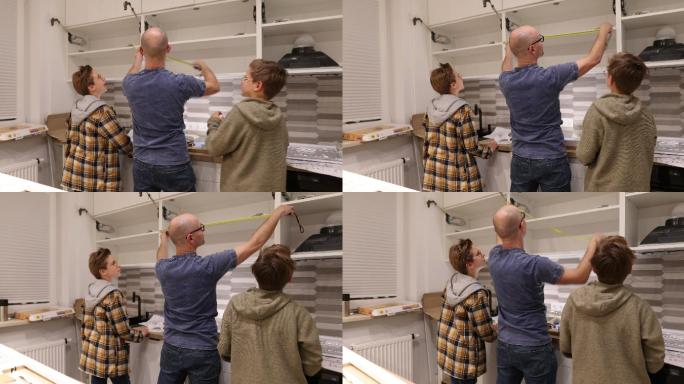 父亲和儿子在家做厨房安装