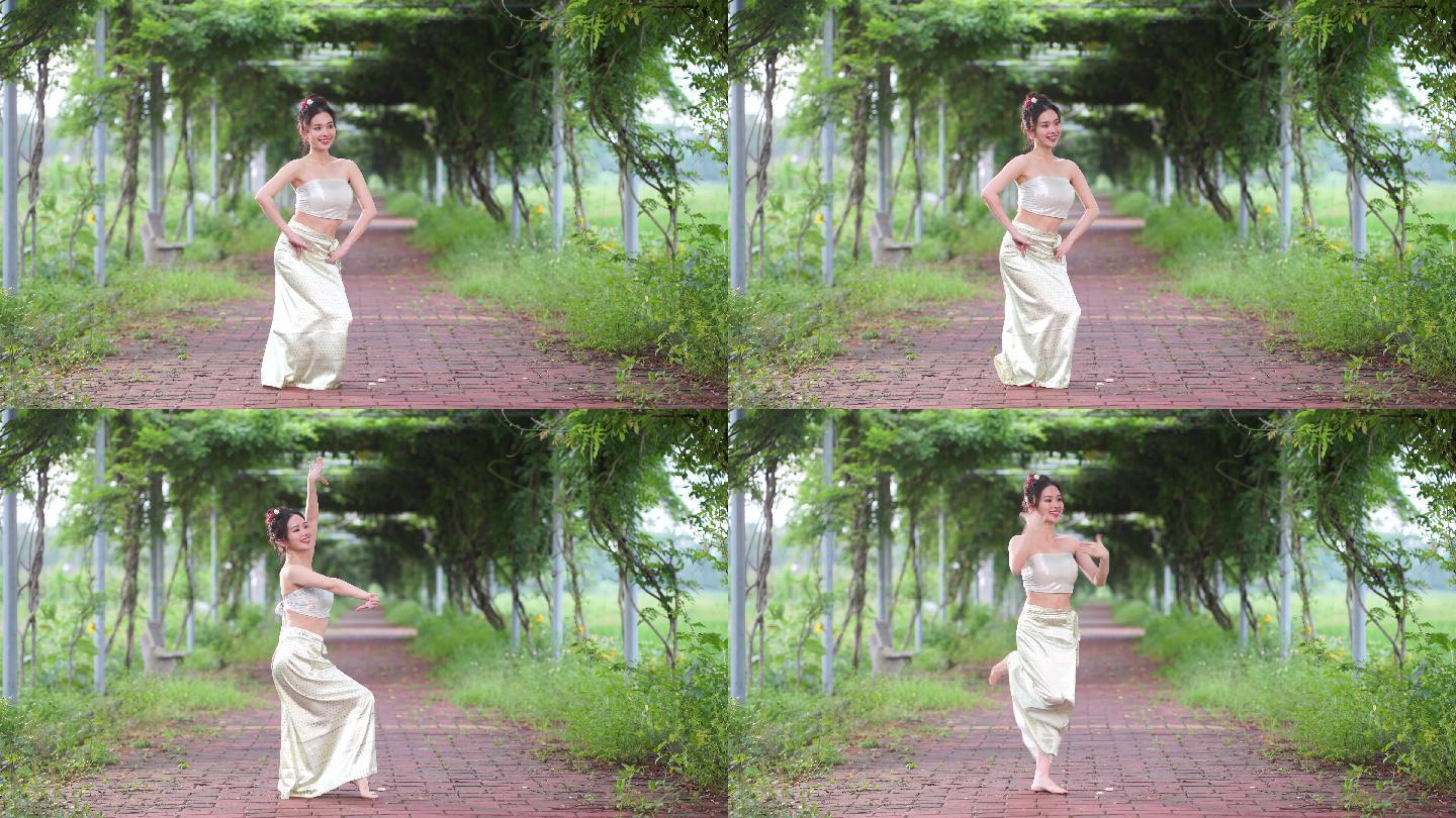 傣族少女在跳传统舞蹈