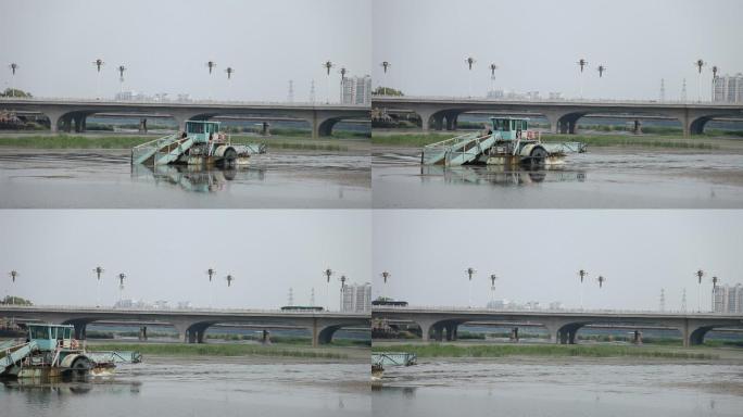 夏日北京潮白河上一辆水面除草机在水面作业