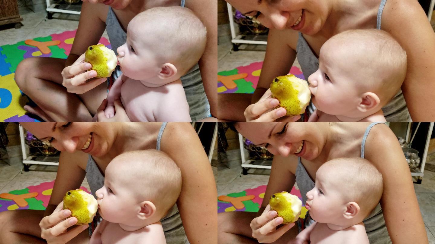 妈妈第一次在家给可爱的女婴吃梨