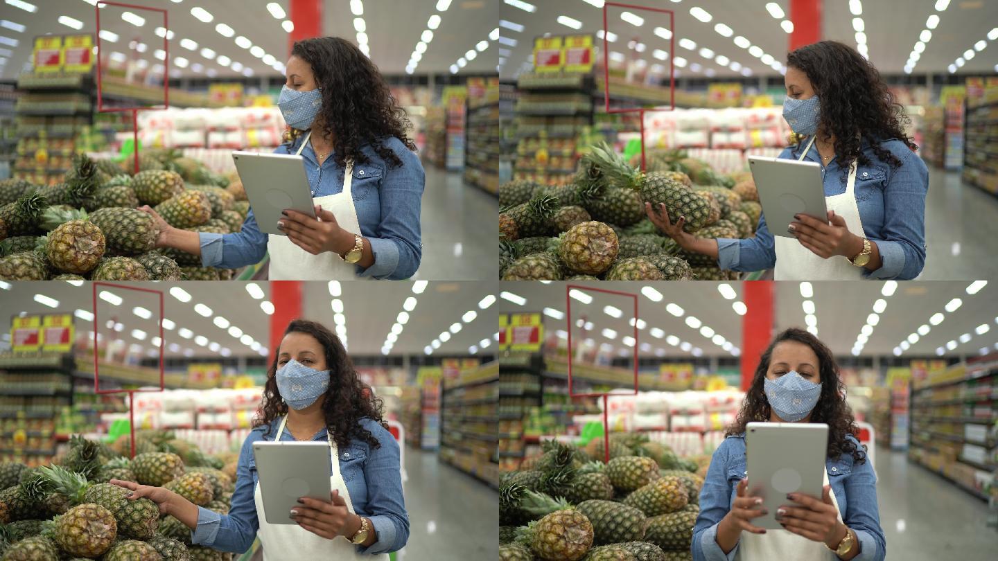使用面罩和手持数字平板电脑的企业主或超市员工肖像