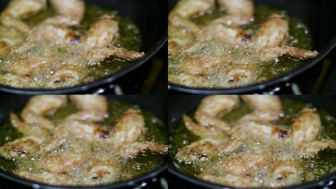 特写：烹饪炸鸡鸡翅油锅中式菜