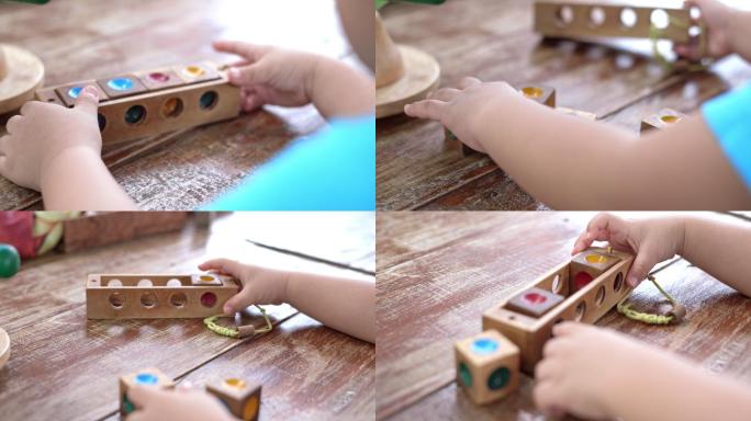 亚洲男婴玩木制玩具