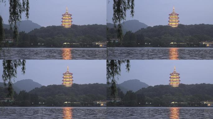 暮色下西湖风景区青山绿树中雷峰塔