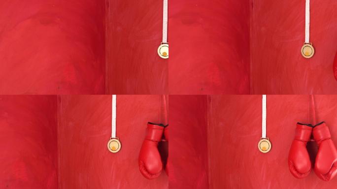 红色拳击手套和奖牌挂在红墙上的4K视频