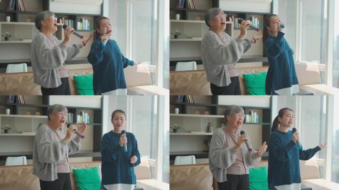 周末休闲活动期间，亚裔华人老太太与女儿在客厅唱卡拉OK跳舞