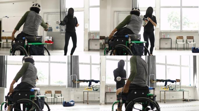 男子轮椅击剑运动员与教练一起训练