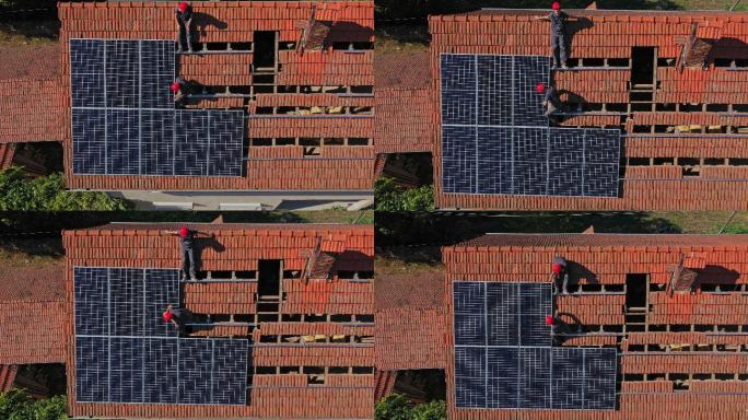 屋顶安装太阳能电池板的工人