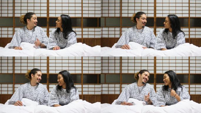 一对混血夫妇躺在日本床上
