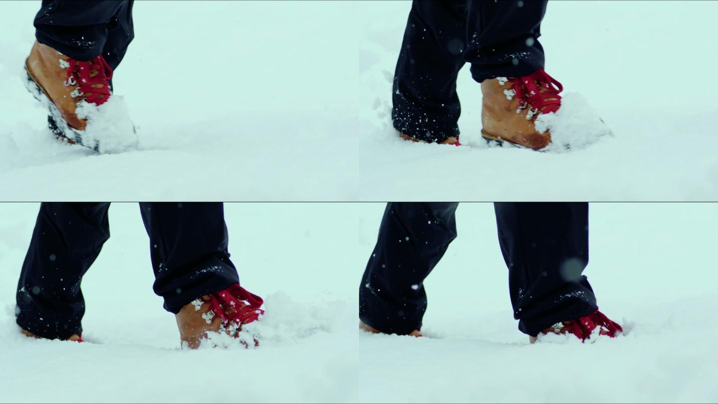 人的脚在雪山上行走的特写镜头。慢动作拍摄库存视频
