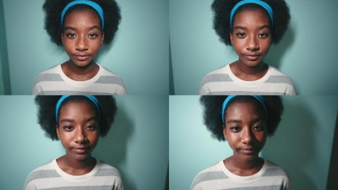 非洲女孩看着相机的肖像，摄影棚拍摄