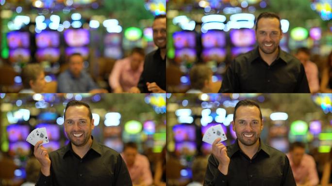拉丁美洲英俊的赌场庄家一边拿着牌一边看着摄像机微笑