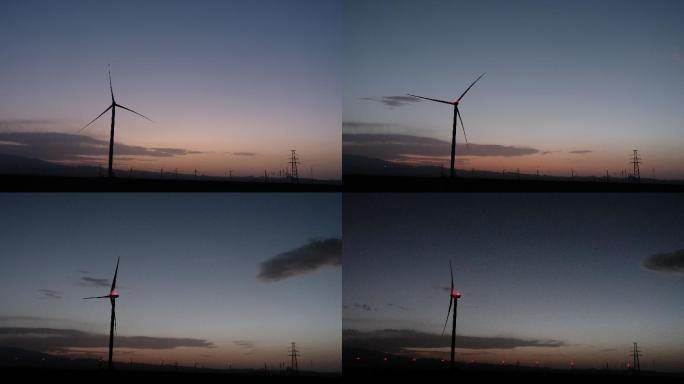 延时拍摄日落时分的风力发电车