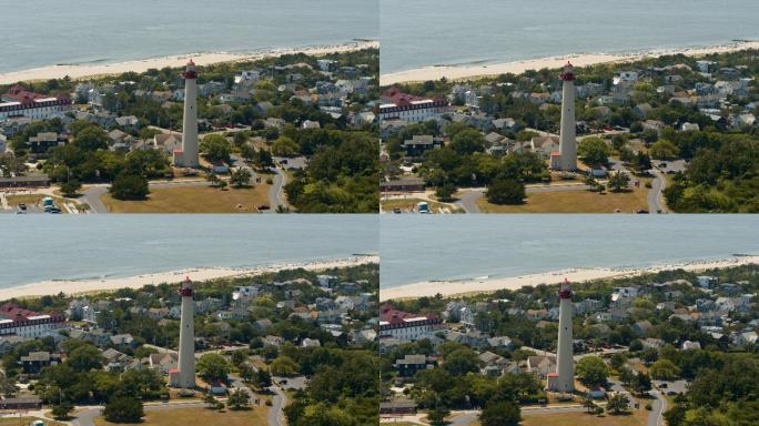 夏天阳光明媚的日子里，新泽西州五月角的灯塔。具有前向摄像头运动的空中全景视频。