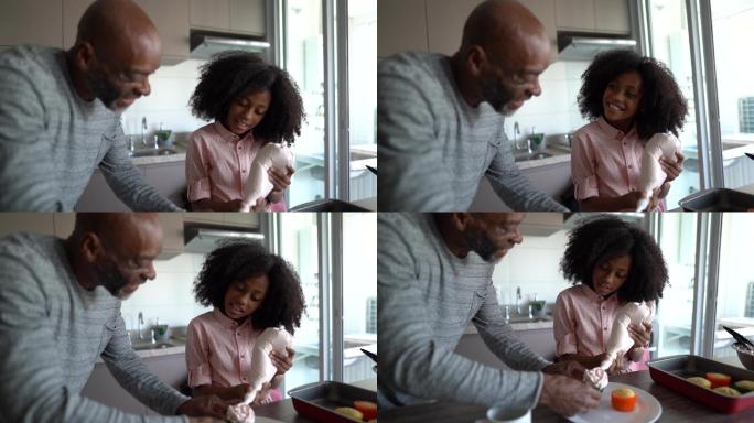 父亲和女儿在家装饰纸杯蛋糕