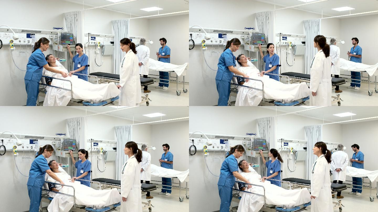 一位女医生来到手术后区域，看望患者。