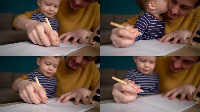 年轻的父亲教他的小男孩画画