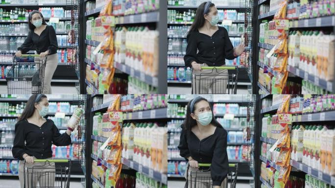 亚洲中年女性在超市或商店购物和搬运购物车时，在上锁后选择和购买果汁，戴上预防冠状病毒大流行的医用口罩