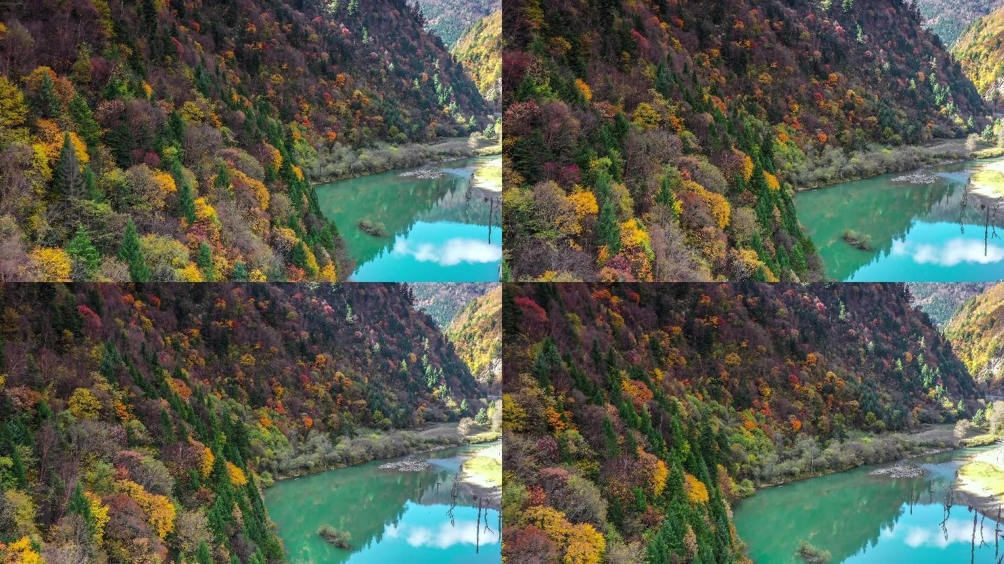 湖的颜色像翡翠，湖岸的山坡是五颜六色的森林