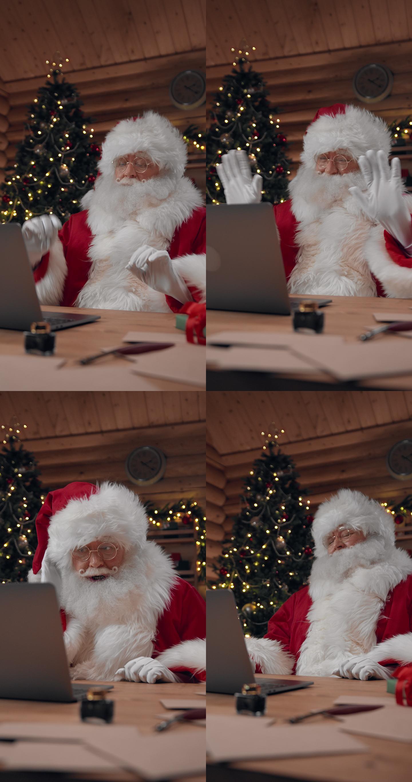 快乐的圣诞老人正在笔记本电脑上与某人进行视频聊天