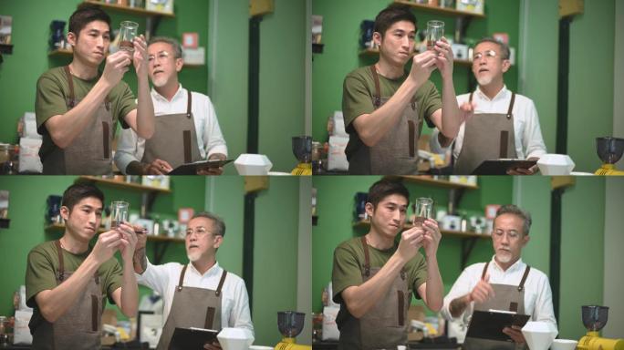 中国亚裔男咖啡师咖啡馆老板与员工在咖啡馆接受冷泡咖啡点滴培训