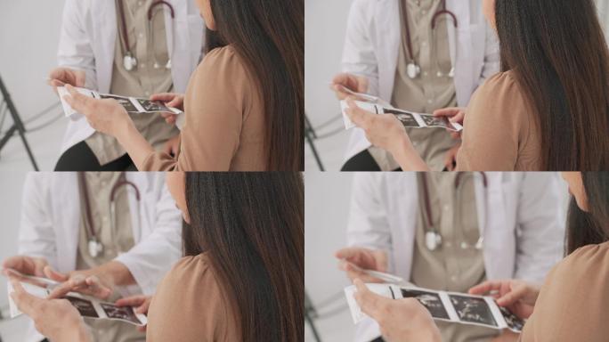 孕妇手持Unta声卡，在医生的密切指导下。