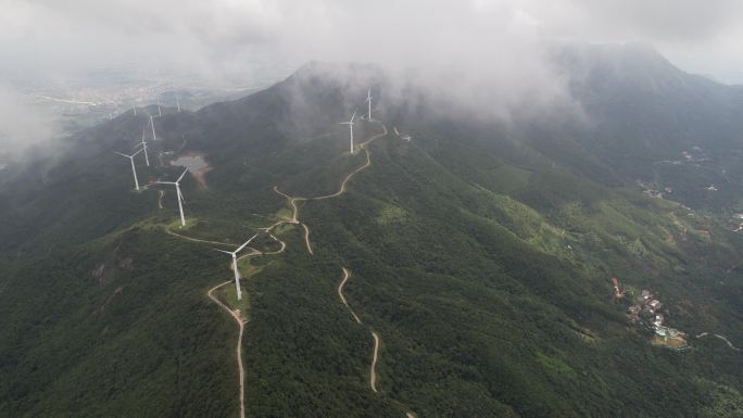 航拍穿云浮山岭风力发电