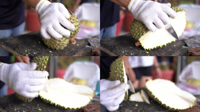 商人正在剥榴莲。水果之王果实食品