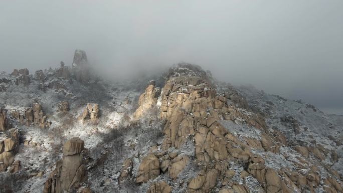 航拍云雾中崂山雪景