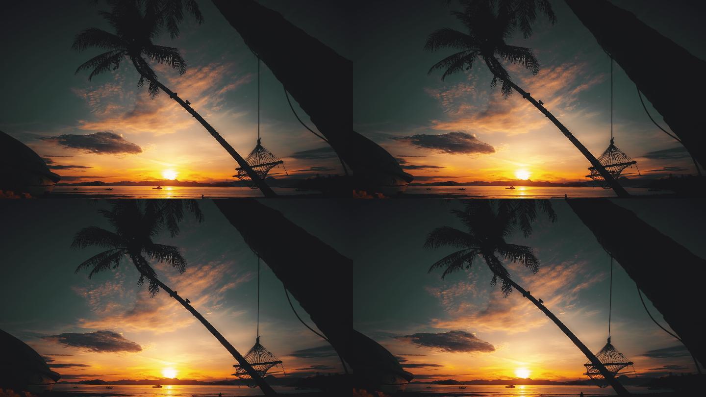 海滩日落时的吊床夕阳余晖晚霞椰子树