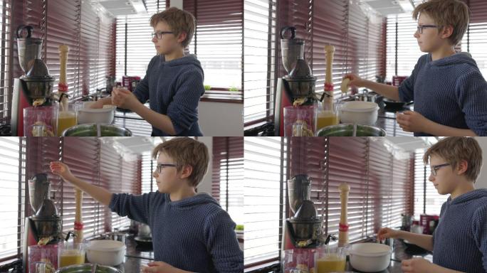 十几岁的男孩在厨房里做果汁