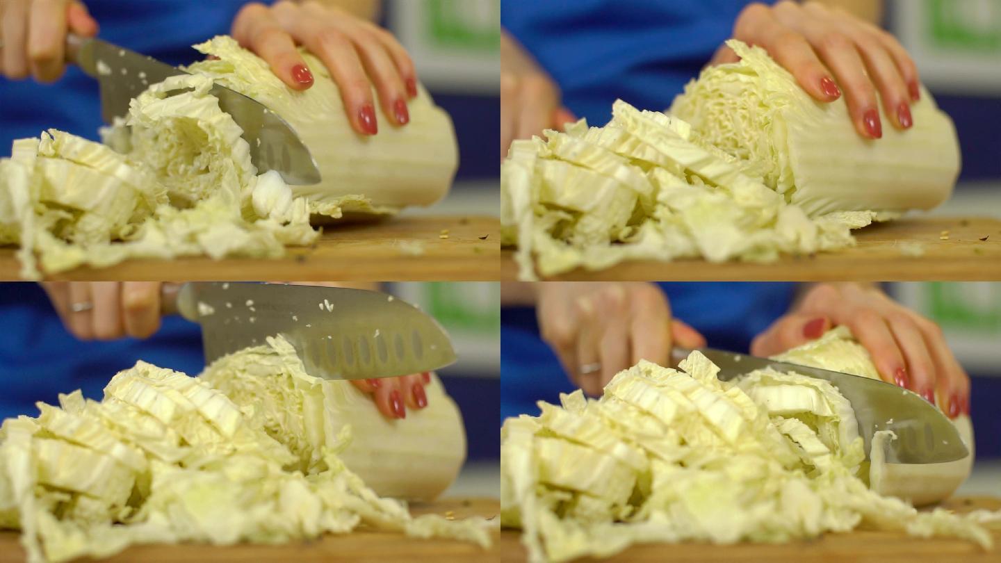 在砧板上切白菜切白菜丝切包菜