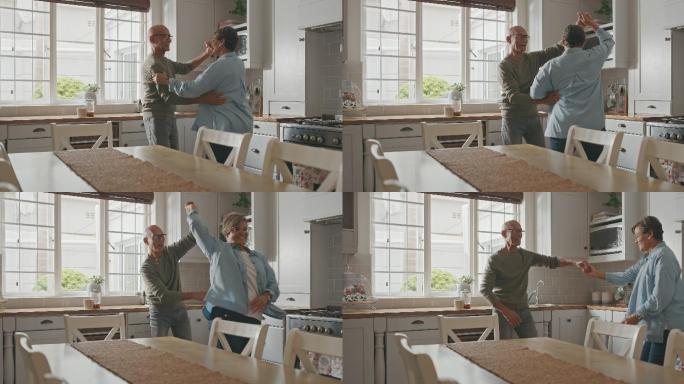 一对老年夫妇在家中厨房跳舞的4k视频片段