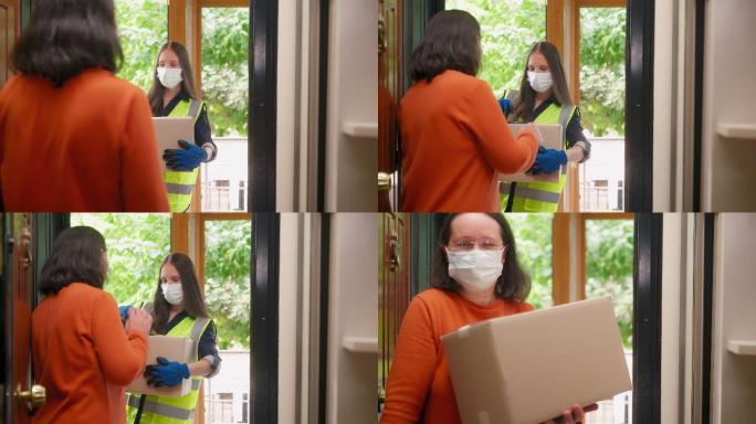 带防护面罩的女性送货员在家向客户送货。收到包裹的客户
