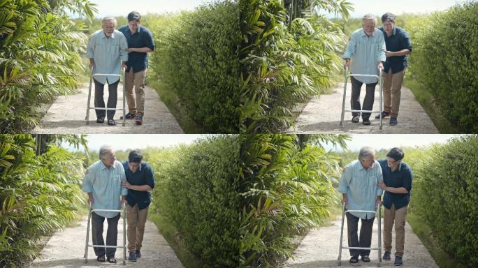 老人与成年儿子一起使用移动步行器，慢动作