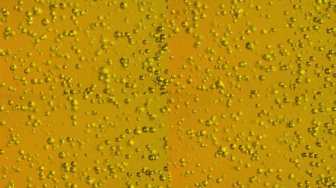 橄榄油泡沫气泡上升黄色液体