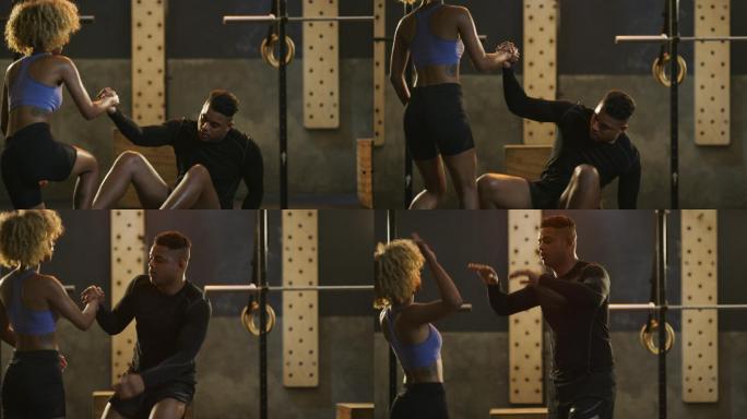 4k视频片段，一对年轻男女在健身房锻炼时互相击掌