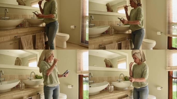 一位女士一边刷牙一边用应用程序打开浴室百叶窗