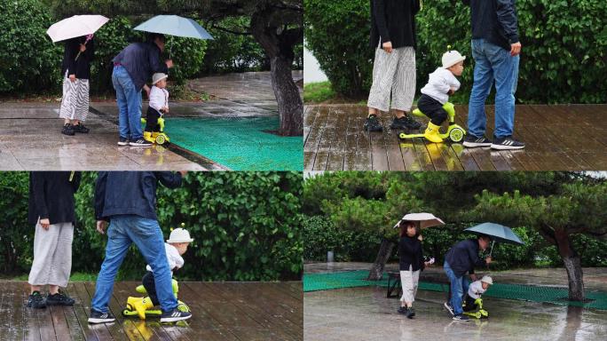 小孩子雨中玩耍