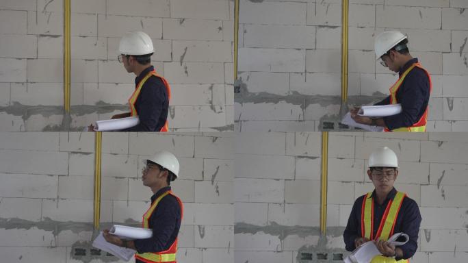 工程部检查承包商根据蓝图建造房屋的工作