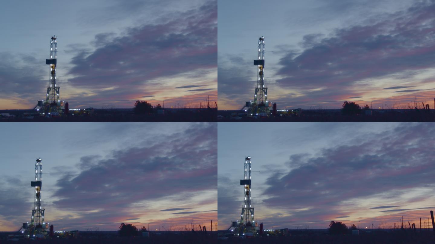 黎明或黄昏时分，在德克萨斯州西部或新墨西哥州东南部卡尔斯巴德附近的美国南部油田，手持压裂油气钻机