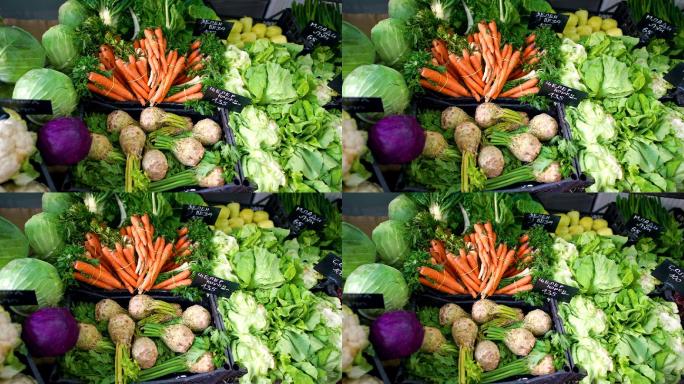 市场摊位上的生鲜蔬菜、胡萝卜、卷心菜、沙拉和甜菜