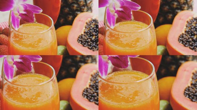 多利镜头：混合水果和一杯新鲜果汁