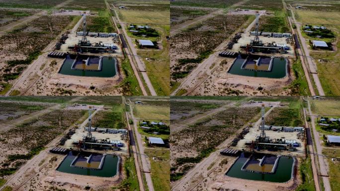 新墨西哥州水力压裂钻机显示储水池的空中无人机剪辑