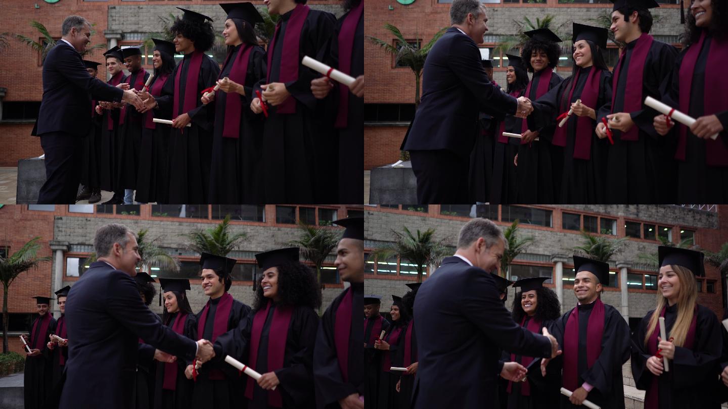 骄傲的大学校长在毕业典礼上微笑着与所有应届毕业生握手