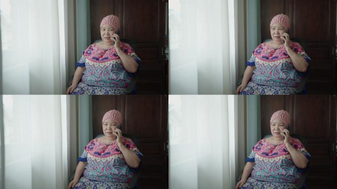 使用智能手机拍摄亚洲癌症老年女性肖像